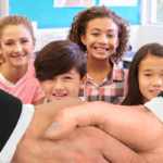 Hand Shake with Kids Smiling