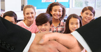 Hand Shake with Kids Smiling