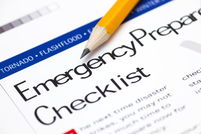 Pencil on top of paper with title "Emergency Preparedness Checklist."