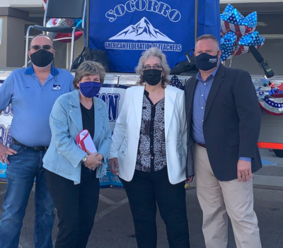 El Paso A-F-T President Ross Moore, A-F-T President Randi Weingarten, Socorro A-F-T President Veronica Hernandez, and Texas A-F-T President Zeph Capo stand outside at an event. All are wearing face masks.